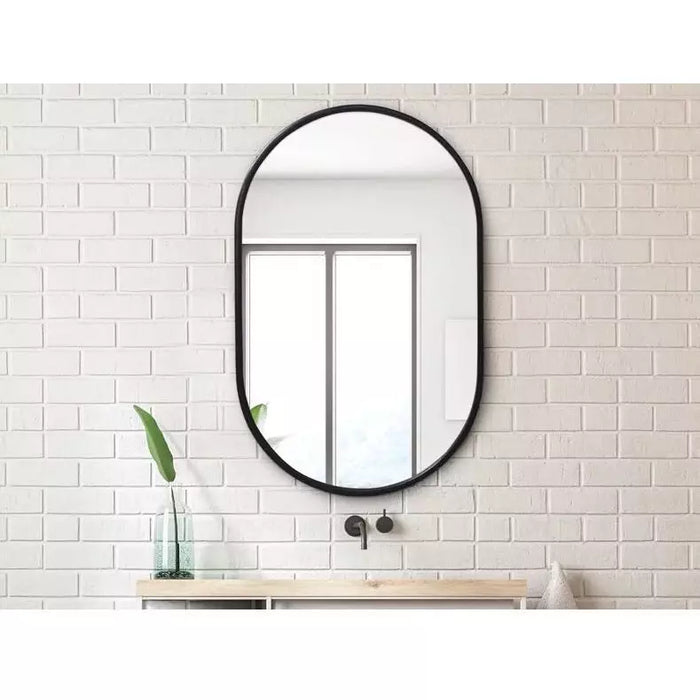 Oval black framed mirror